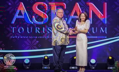 Dato Sri Tiong King Sing, Malaysian Minister of Tourism, Arts and Culture hands over the symbolic gavel to Philippine Tourism Secretary Christina Garcia Frasco for the chairmanship and hosting of the ASEAN Tourism Forum (ATF) in 2026 during the closing ceremony of the ASEAN Tourism Forum in Johor Bahru, Malaysia, 20 January 2025.