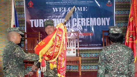 ZAMBOANGA. The Marine Battalion Landing Team-1 (MBLT-1) designates a female officer to lead its 1st Marine Company (1MC) based at Tala Diversion Road in Lumbangan village, Zamboanga City. A photo handout shows Captain Mark Baldazan (left) relinquished command to 1st Lieutenant Armela Mae Ellar-Gil (right) in a turnover ceremony on Saturday, February 8, 2025, at the 1MC headquarters at Tala Diversion Road in Lumbangan village, Zamboanga City.