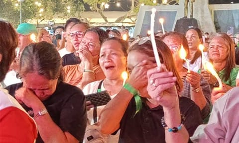 A Duterte supporter cries while singing during a candlelight vigil at Rizal Park on Tuesday, March 11, 2025. Hundreds of Dabawenyos gathered to pray and show support for the former president, who was arrested earlier that day at Ninoy Aquino International Airport (NAIA) on an International Criminal Court (ICC) warrant for alleged crimes against humanity.