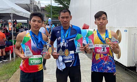 DAVAO MALE CHAMPIONS. Men’s champions, from left James David Mondejar Langca-ag (10K), Elmer Bartolo (16K), and Freight Abraham Cabanig (5K), in one frame after topping their respective categories in the Sante Barley Trilogy Run Asia-Davao Leg 1, held Sunday, March 23, 2024, at Azuela Cove, Lanang.