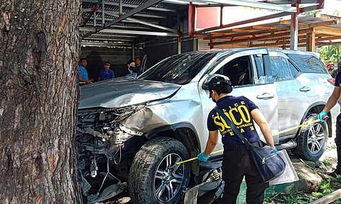Scene of the Crime Operatives examine the SUV that carried Datu Odin Sinsuat election officer Maceda Lidasan Abo and husband Jojo, who were both killed in an ambush Wednesday morning, March 25, 2025.