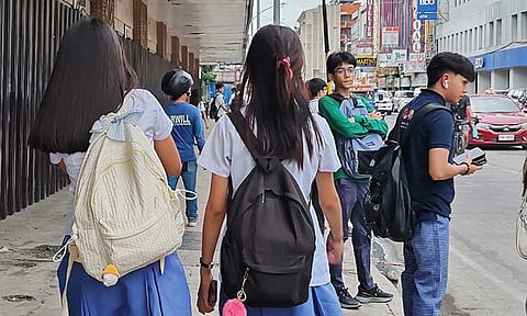 REVISITING DAVAO’S NO BACKPACK POLICY. Two high school students walk down C.M. Recto Avenue in Davao City after a long day of classes. While backpacks are strictly regulated in certain areas, particularly along Roxas Avenue—the site of the tragic bombing on September 2, 2016—the Public Safety and Security Office (PSSO) is considering revising the city’s "No Backpack Policy" for safety and convenience. Backpacks are also banned at public gatherings such as church and major events.