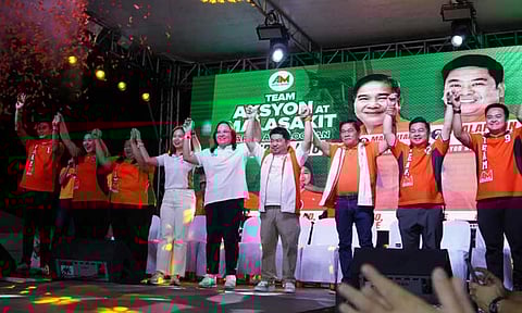 Team Aksyon at Malasakit raising the hands of Trabaho first nominee Atty. Johanne Bautista at the Distrito Uno Grand Rally in Caloocan.
