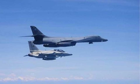 CLOSE FORMATION. A Philippine Air Force (PAF) FA-50PH fighter jet is seen here flying with an American Rockwell B-1B "Lancer" strategic bomber aircraft during a bilateral air patrol over the West Philippine Sea on Tuesday (April 29, 2025). The PAF said this activity is part of the ninth multilateral maritime cooperative activity (MMCA) between the Armed Forces of the Philippines (AFP) and the US Pacific Air Forces (PACAF). (Photo courtesy of the 5th Fighter Wing)