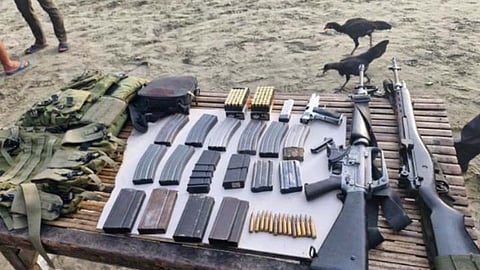 ZAMBOANGA. Police and military operatives seize high-powered firearms and ammunitions aboard a wooden-hulled vessel on Thursday, May 1, 2025, in Sitio Dulongin, Matiag village, Siocon, Zamboanga del Norte. The 16 people aboard the vessel were placed under investigation. (SunStar Zamboanga)
