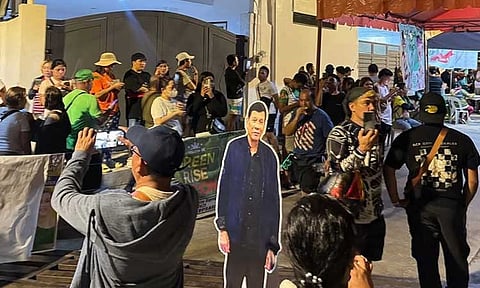 Supporters of former President Rodrigo Duterte gathered outside his residence in Doña Luisa Subdivision, Davao City, late Wednesday evening, April 30, 2025, following reports of a potential surprise raid by security forces.