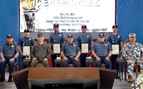 Brigadier General Jack L. Wanky, director of the Police Regional Office in Western Visayas (PRO 6), presents plaques of appreciation to the Philippine Army and the Philippine Coast Guard during a ceremony at Camp Delgado on May 19, 2025, for their key role in securing the peaceful 2025 midterm elections.
