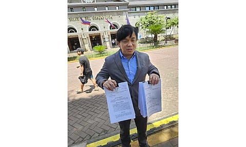 Lawyer Jeff Miranda shows the petition of Mylyn Pineda Cayabyab asking the Commission Elections for a recount of the City of San Fernando mayoral race result. Reelectionist Mayor Vilma Caluag garnered 127,124 votes, defeating Cayabyab who earned 49,061 votes.

Photo by Ian Ocampo Flora