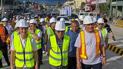 ZAMBOANGA. Department of Public Works and Highways Secretary Manuel Bonoan (center) is joined by Mayor John Dalipe (left) and former Mayor and 1st District Representative Celso Lobregat (right), the project proponent, as he leads the opening of the P450 million Sta. Cruz Flyover, the first in Zamboanga Peninsula, in the afternoon of Thursday, May 22, 2025. (SunStar Zamboanga)