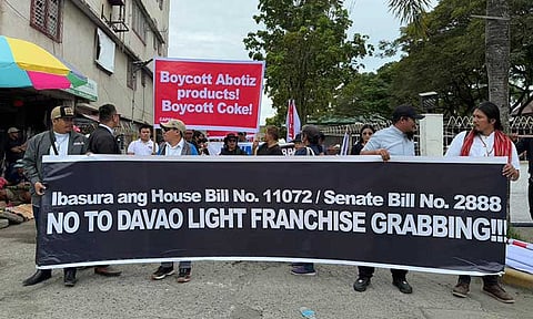 Protesters dressed in black gather along Rizal Street, Tagum City, for the Nordeco Peace Rally. Members and supporters of Northern Davao Electric Cooperative, Inc. (NORDECO, Inc.) stand united against Senate Bill 2888 and House Bill 11072, which seek to extend Davao Light and Power Company’s (DLPC) franchise into Davao del Norte and Davao de Oro.