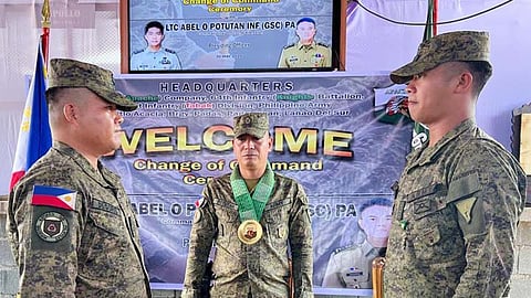 ZAMBOANGA. Lieutenant Colonel Abel Potutan, 64th Infantry Battalion (64IB) commander (center), installs First Lieutenant Rewine Degorio (left), as the new 64IB’s Alpha Company, replacing Captain Dionisio Padillon, Jr. (right), in a ceremony on Friday, May 30, 2025, at the company’s headquarters in Padas village, Pagayawan, Lanao del Sur. (SunStar Zamboanga) 
