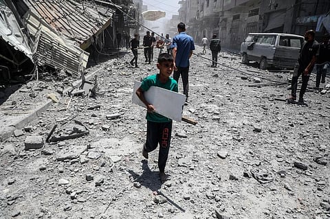 PALESTINIANS are seen among the rubble of destroyed houses after an Israeli airstrike in Gaza City on May 31, 2025. / 