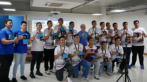 PROUD PRESIDENT WITH THE MIGHTY EAGLES. Ateneo de Davao University (AdDU) president Fr. Karel San Juan, SJ, celebrates with the 2025 Palarong Pambansa secondary boys basketball champions, the Davao Eagles, during a special photo op on June 3. He honored the team, mostly AdDU players, with three reinforcements, by presenting tokens of appreciation for their historic win in Ilocos Norte. The Eagles’ victory is a proud moment for the university and the region. 