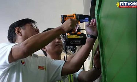 ‘BRIGADA ESKWELA’. President Ferdinand R. Marcos Jr. installs a blackboard at the Barihan Elementary School in Malolos, Bulacan during the kickoff of Brigada Eskwela 2025 on Monday (June 9, 2025). The President joined parents, teachers, and volunteers in preparing classrooms ahead of the June 16 school opening. (RTVM screengrab)