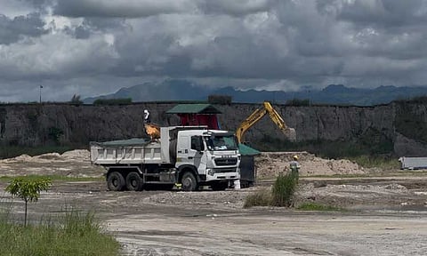 INSPECTION
A worker of Eco Protect Management Corporation inspects incoming trucks to ensure that only residual wastes enter the landfill. - Princess Clea Arcellaz