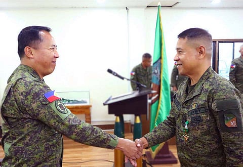 ZAMBOANGA. Major General Leonardo Peña, 11th Infantry Division (11ID) commander (left), expresses gratitude and congratulates Lieutenant Colonel Dante Mantes for his excellent performance during his tenure as the Division of CAA Affairs Office chief. Lieutenant Colonel Roland Arreola (not in photo), who replaced Mantes, assumed office in a ceremony Wednesday, June 11, at the 11ID headquarters.