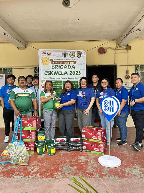 SM Lanang Assistant Mall Manager Apple Legario (6th from right) turned over cleaning supplies and tools to Vicente Hizon, Sr. Elementary School Head Lubel Banaria.
