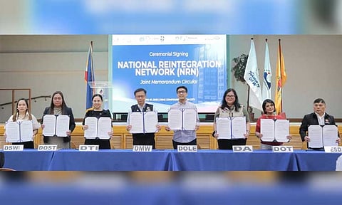 In photo: DTI Secretary Cristina A. Roque and DMW Secretary Hans Cacdac, alongside representatives from other government agencies