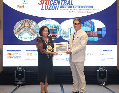 CDC President and CEO Atty. Agnes VST Devanadera (left) receives a Certificate of Appreciation from Philippine Multimodal Transport and Logistics Association President Erich Lingad (right) during the 3rd Central Luzon Transport and Trade Conference held at Clark Marriott Hotel. (CDC Photo)