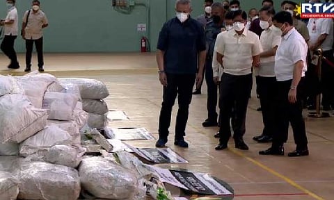 FLOATING SHABU. President Ferdinand R. Marcos Jr. inspects seized illegal drugs, including those “floating shabu” recovered in various coastal towns in Luzon during his visit to the Philippine Drug Enforcement Agency (PDEA) office in Quezon City on Tuesday (June 24, 2025). The President invited members of the media to witness the destruction of seized illegal drugs to ensure transparency. (RTVM screengrab)