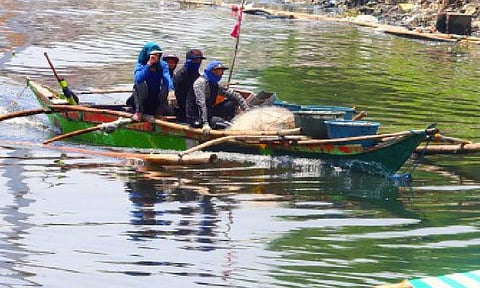 FUEL SUBSIDY. Fishers head to the Las Piñas City Fish Port with their catch on June 30, 2024. The Department of Agriculture on Monday (June 23, 2025) said farmers and fishers will receive fuel assistance from the government once global prices hit USD80 per barrel amid the Israel-Iran conflict. (PNA photo by Avito C. Dalan)