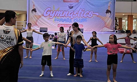MALL GYMNASTICS IN MOTION. Young participants stay focused as their instructor leads a session during the free Davao Golden Twist Gymnastics clinic at Ayala Malls Abreeza on Tuesday, June 25, 2025. The summer clinic runs from June 23 to 27.