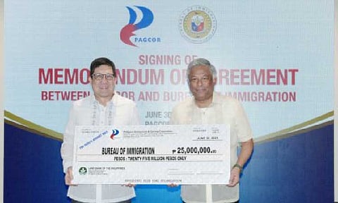 REPATRIATION EXPENSES. PAGCOR chairperson and CEO Alejandro Tengco (right) hands over the first tranche of the agency’s PHP50-million grant to Immigration Commissioner Joel Anthony Viado on June 30, 2025 at the PAGCOR Executive Office in Pasay City. The grant would help cover the repatriation expenses of illegal POGO workers currently held at the BI Warden Facility and Protection Unit. (PAGCOR photo)
