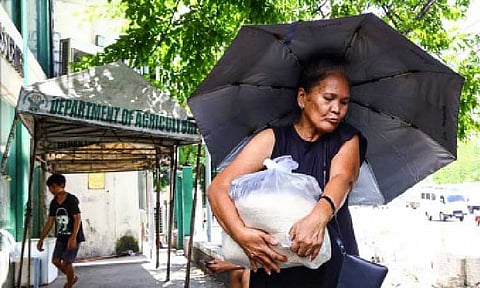 CHEAP RICE. An elderly citizen buys PHP20-per-kg. rice under the "Benteng Bigas Meron Na!" (BBM Na!) at the Department of Agriculture (DA) - Agribusiness Development Center’s Kadiwa ng Pangulo along the Elliptical Road in Diliman, Quezon City on May 22, 2025. The DA on Wednesday (July 2, 2025) said the BBM Na is now available in 94 locations nationwide. (PNA photo by Joan Bondoc)