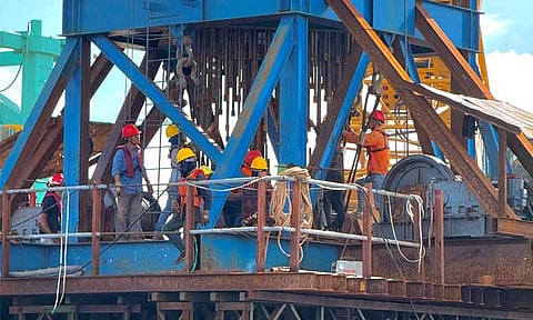 BRIDGE UNDER FIRE. Workers install structural reinforcement bars for the Samal Island–Davao City Connector (SIDC) Bridge in this photo taken last March 2025 in the Island Garden City of Samal. The Supreme Court recently issued a Writ of Kalikasan following a petition filed by environmental advocates.