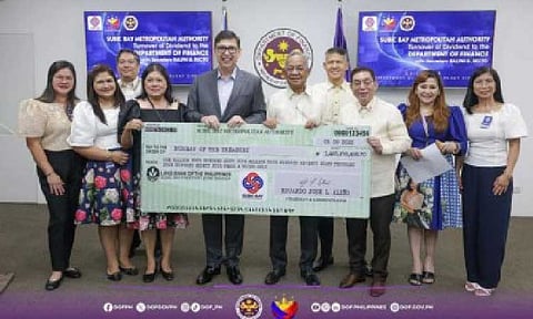 DIVIDEND REMITTANCE. Subic Bay Metropolitan Authority Chairperson and Administrator Eduardo Jose Aliño (5th from right) turns over SBMA's PHP1.47 billion dividend to Finance Secretary Ralph Recto on Monday (July 14, 2025). Under the Dividend Law, GOCCs are required to remit at least 50 percent of their net earnings during the preceding year as dividends to the national government. (Photo courtesy of DOF)
