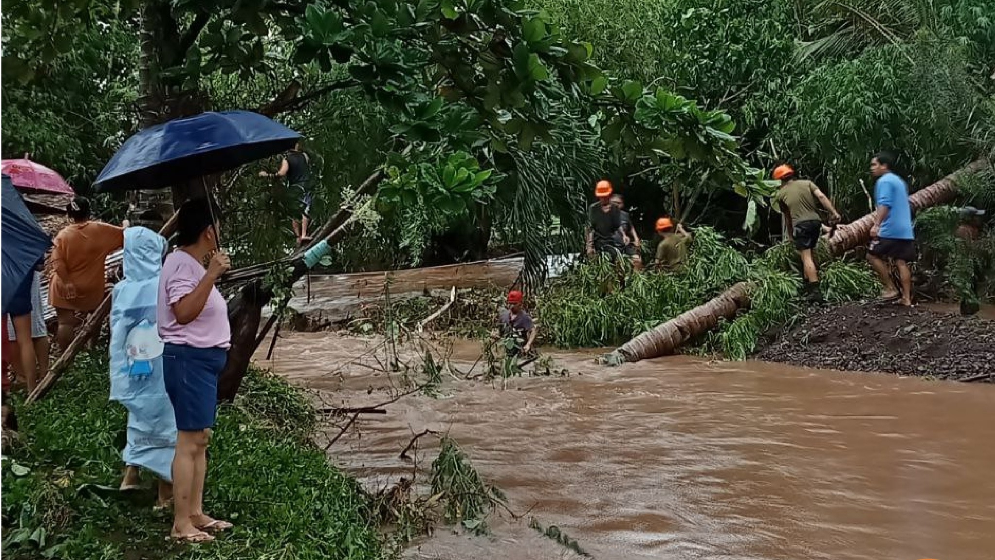 ANTIQUE. Soldiers from the Philippine Army’s 61st Infantry Battalion and community volunteers clear a road in Barangay Importante, Tibiao, Antique, on July 17, 2025, following heavy rains and flooding caused by Tropical Depression Crising. 
