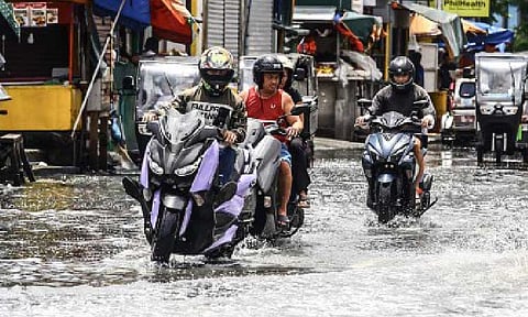 INUNDATED. Motorcycle riders ply through the flooded F. Sevilla Boulevard in Barangay Tañong, Malabon City on July 7, 2025, caused by rains and high tide. Senators lauded President Ferdinand R. Marcos Jr.'s call for an audit of flood control programs and for accountability over alleged misuse of public funds, saying the strong pronouncement during his fourth State of the Nation Address was long overdue and must be followed by decisive action. (PNA photo by Joan Bondoc)  