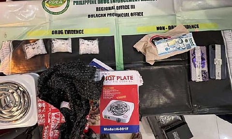 BULACAN. The seized drugs and other evidence seized from 2 female suspects during a buy-bust operation in a fast food outlet in Balagtas, Bulacan on July 28. (Photo courtesy of PDEA)