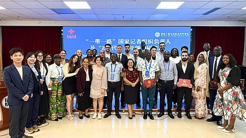 GRADUATION MOMENT. The 27 delegates of the Belt and Road Countries Journalist Leaders and Gen Z Young Leaders Seminar share a proud photo with National Radio and Television Administration (NRTA) deputy vice president Liu Linhai and Chinese seminar staff David, Alex, Jade, and Di.