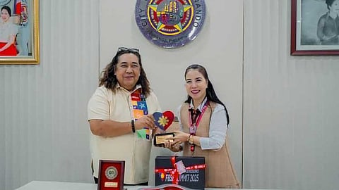 Department of Tourism Regional Director Richard Daenos handed over to Mayor Vilma Caluag the Filipino Brand of Service Excellence Government Partner award on August 4, 2025 at Heroes Hall. (Photo courtesy of CSFP CIO)