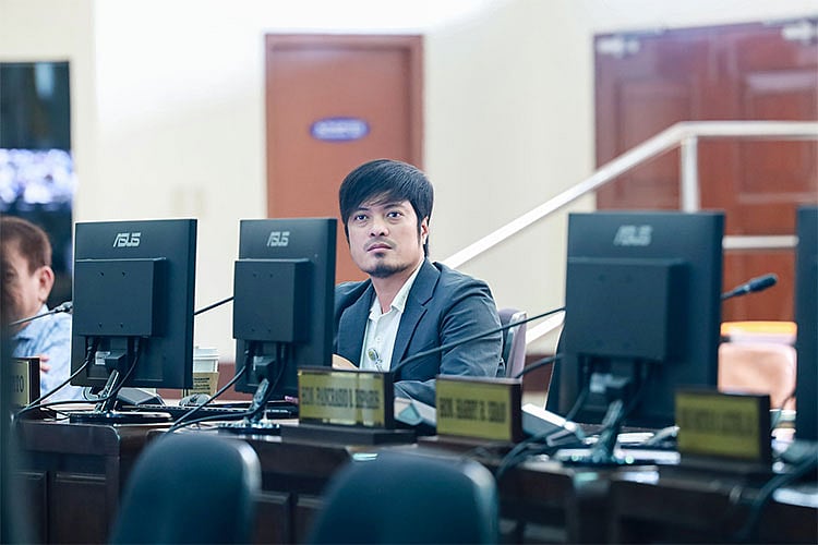 Winston Pepito seated during a Cebu City Council session