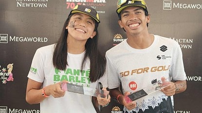 CHAMPIONS. Southeast Asian Games medalists Erika Nicole Burgos (left) and Kim Andrew Remolino topped their respective divisions in the Sunrise Sprint Lapu-Lapu in Mactan, Cebu, on Aug. 10, 2025.  / VIA PNA