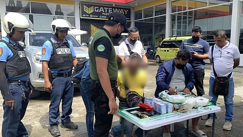 ZAMBOANGA. Lawmen score a significant accomplishment on Tuesday, August 19, in the campaign against illegal drugs as they arrest a high-value target suspect (in yellow t-shirt) and seize some P27.2 million worth of suspected shabu in a buy-bust  at a gasoline station along Mayor Jaldon Street, Canelar village, Zamboanga City. (SunStar Zamboanga)