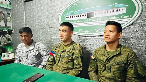 Philippine Army Lieutenant Colonel Louie Steve Kilakil, team leader for the calendar year 2025 Philippine Military Academy (PMA) entrance examination in Iloilo City with Staff Sergeant Luisito Ramirez from the Philippine Army and Chief Petty Officer Ariel Jarata from the Philippine Navy. (Photo by Leo Solinap)