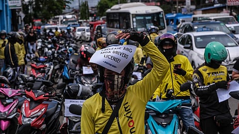 Ride-hailing service drivers with Piston Cebu held a picket rally at the Land Transportation Office (LTO) Central Visayas Main Office on N. Bacalso Avenue, Cebu City, on September 15, 2025. They called for the release of their confiscated licenses and impounded motorcycles, protesting what they claim to be the selective apprehension of Maxim riders. (Juan Carlo de Vela)