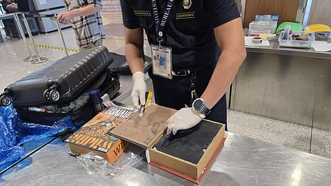 ILLEGAL CONTENT. The substance suspected to be shabu which was found in the luggage of South African national Keith Charles Moore Koekemoer was placed inside this box.  /