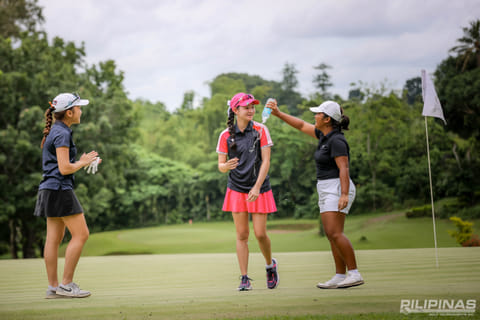 Tashanah Balangauan of Cebu gets a celebratory douse from Davao’s Precious Zaragosa as Breanna Rojas looks on.