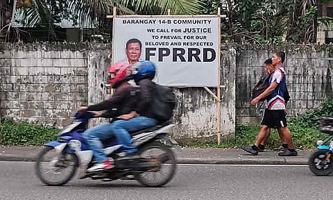 PROLONGED JUSTICE. A tarpaulin in Barangay 14-B, Davao City, calls for justice for former President Rodrigo Duterte on September 8, 2025, the same day the International Criminal Court (ICC) postponed his September 23 hearing on alleged crimes against humanity tied to the war on drugs. The ICC granted Duterte’s request for suspension, citing his alleged unfitness to stand trial. Human rights groups claim the drug war killed over 30,000 people, while government data puts the figure at around 6,000. 