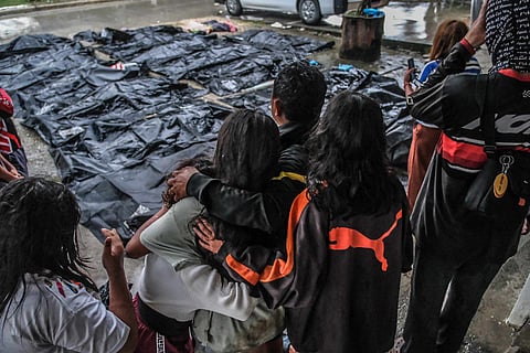 CEBU. Family members weep as they watch the remains of their loved one, a victim of the 6.9-magnitude earthquake that struck Bogo City on Tuesday evening, September 30, 2025. These photos were taken on Wednesday, October 1. 