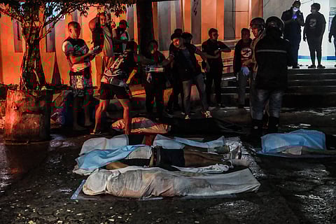 CEBU. Bodies of victims of the 6.9-magnitude earthquake are placed in body bags outside Cebu Provincial Hospital in Bogo City on October 1, 2025. 