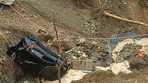 Police injured after car falls off cliff in Balamban, Cebu due to strong water flow