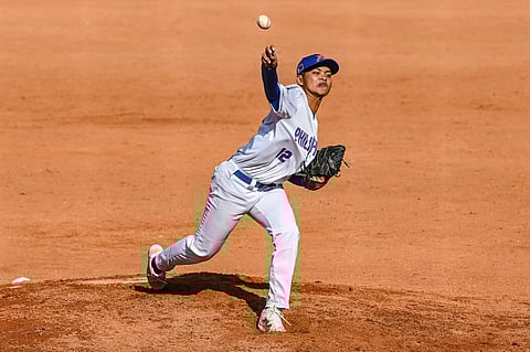 PH DOMINATES MALAYSIA. Philippines’ pitcher Clarence Caasalan, who struck out six batters in three innings, delivers a pitch during the men’s baseball game against Malaysia on Monday, Dec. 9, 2025, at the Queen Sirikit Baseball Stadium in Pathum Thani, Thailand, as the team extended its perfect record with a 21-0 win in the 33rd SEA Games.