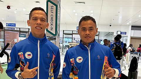 BANGKOK-BOUND. Philippine distance runners Sonny Wagdos, left, and Arlan Arbois pose before their delayed flight to Bangkok for the 2025 Southeast Asian Games. Wagdos will compete in the 5,000m and 10,000m, while Arbois, a marathon silver medalist in 2023, aims for another podium finish.