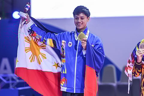 FIRST GOLD FOR PH. Justin Kobe Macario performs his freestyle poomsae routine during the men’s individual event at the 33rd Southeast Asian Games in Bangkok on Wednesday, dazzling judges with flips and precise kicks to secure the Philippines’ first gold medal of the Games.