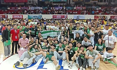 CHAMPIONS AGAIN. The University of the Visayas (UV) Green Lancers -- together with school officials, coaching staff and some of their supporters -- celebrate after defeating the University of Cebu Webmasters in Game 3 of the Cesafi Finals at the Cebu Coliseum, securing their fourth straight championship and 17th overall title. / 